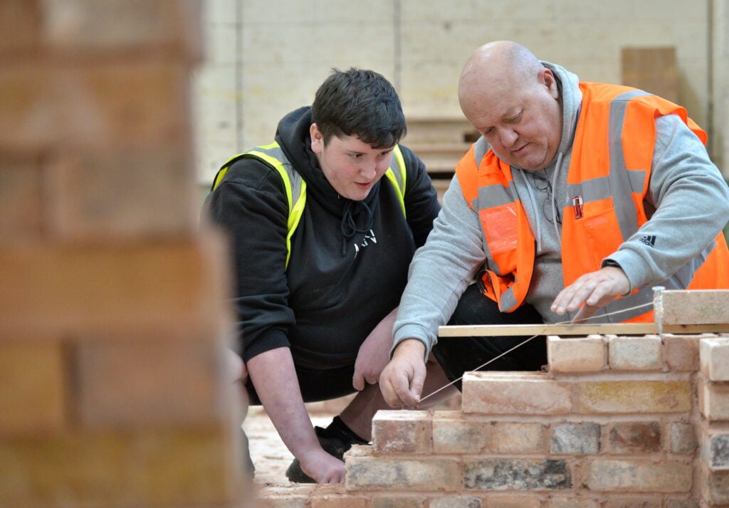 Bricklaying student and tutor
