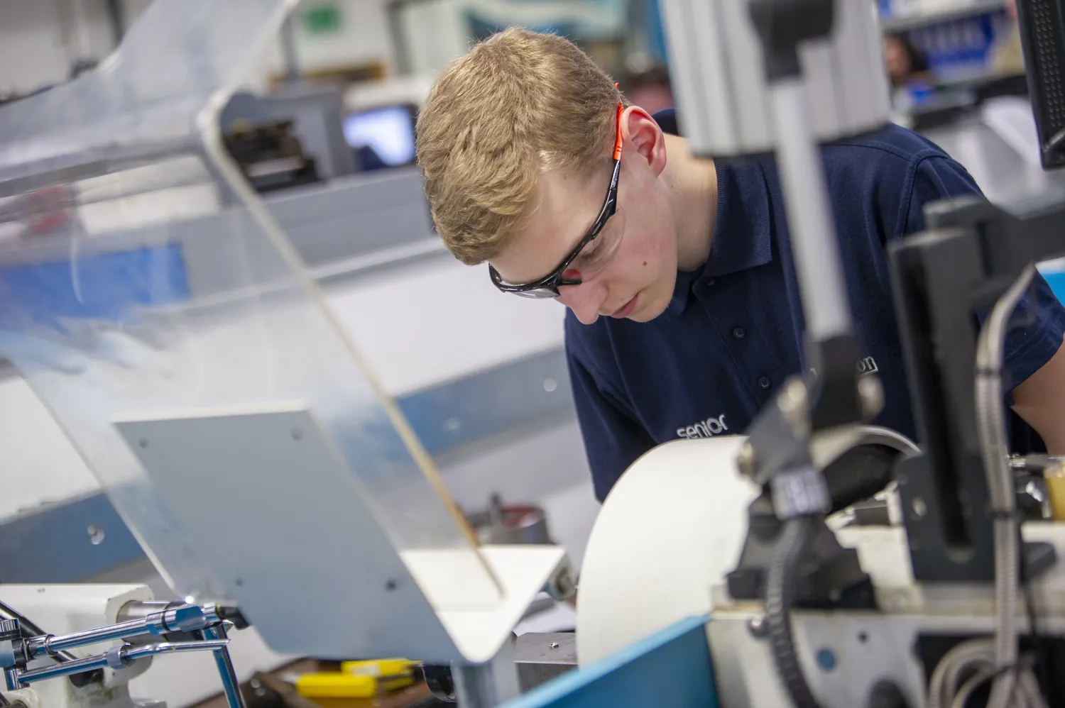 engineering apprentice using machinery
