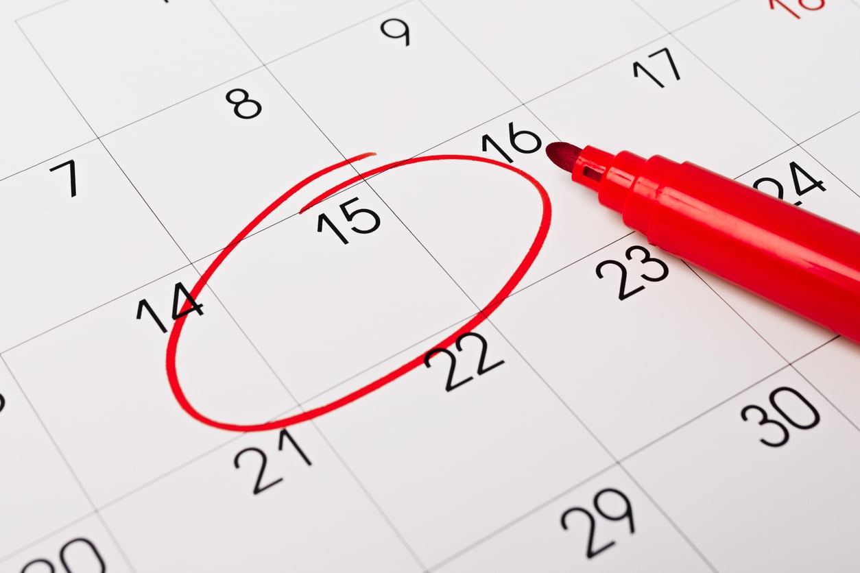 Calendar page with red pen close up