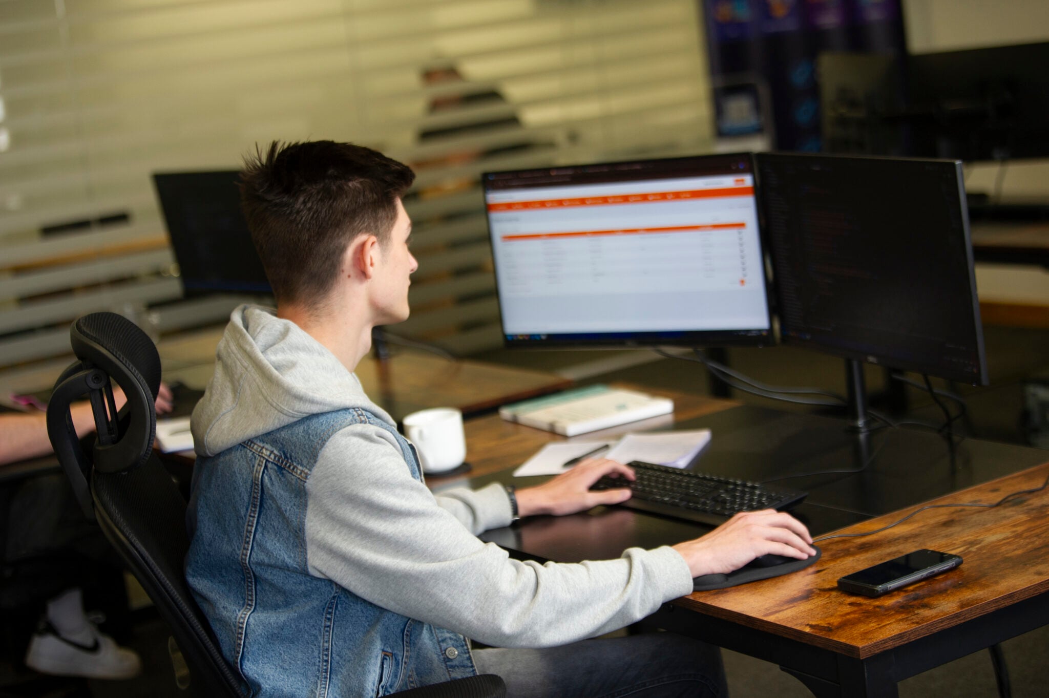 Student typing on a computer