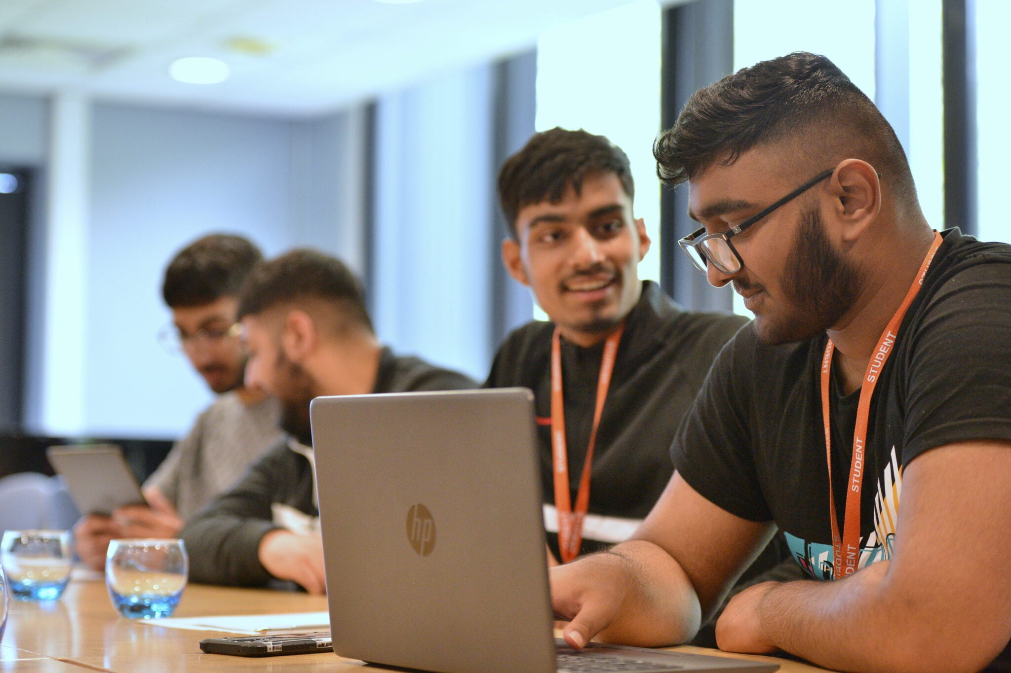 Students talking around computers