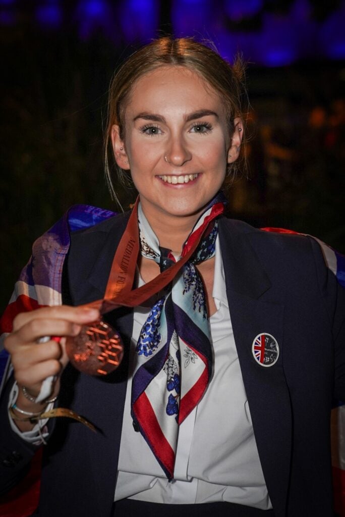 Shelby Fitzakerly with her medal of excellence medal