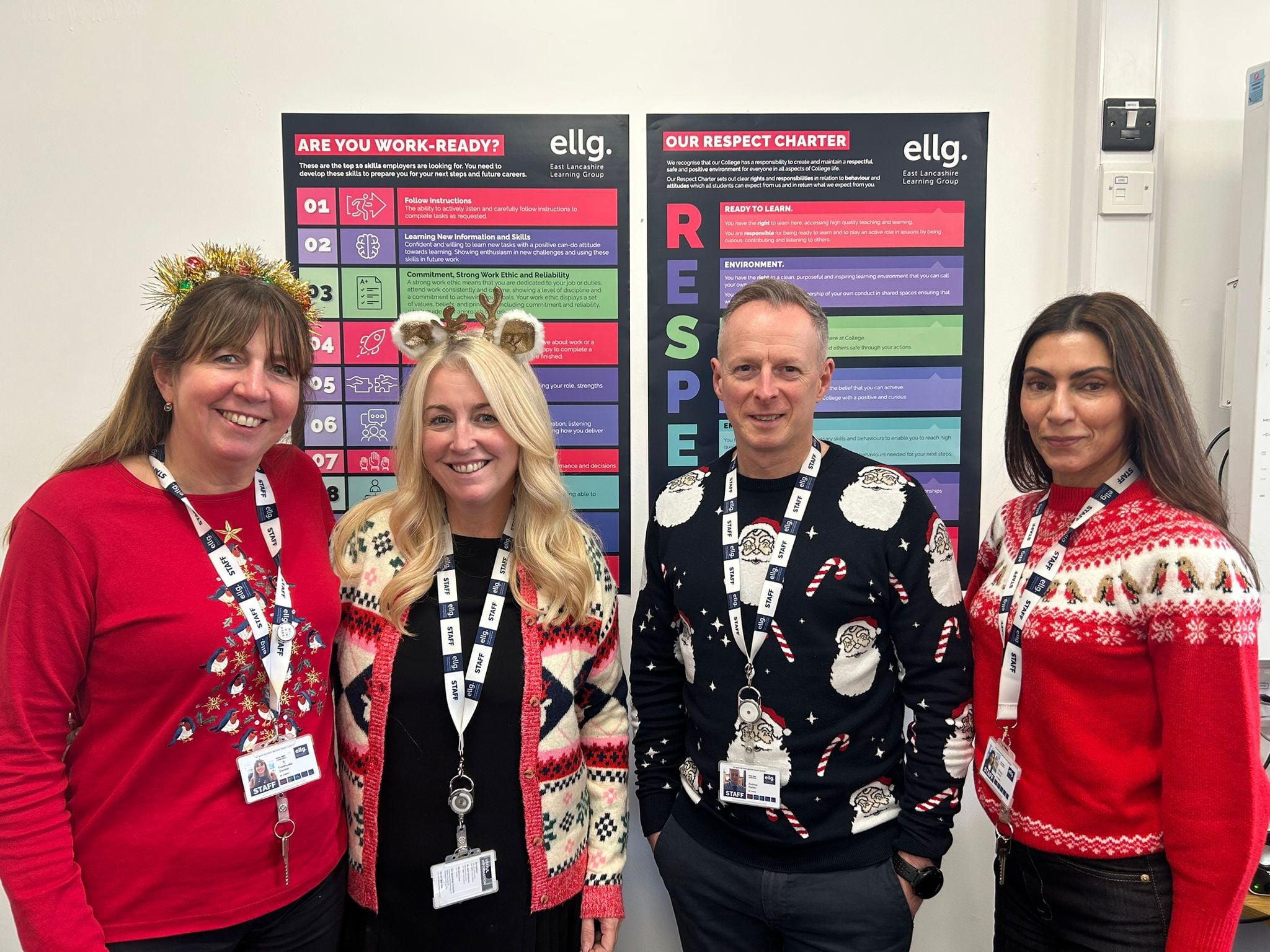 Members of staff wearing their christmas jumpers