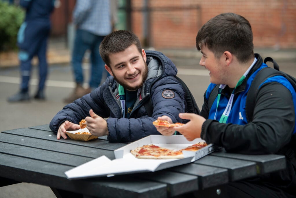 two students eating together